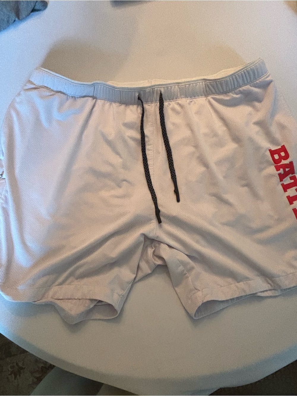Men's White Athletic Shorts with Red Side Lettering